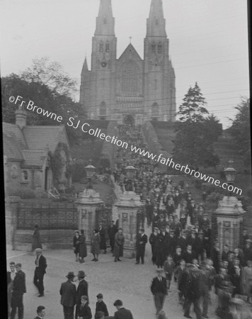 LEAVING CHURCH AFTER MISSION STATUE OF ARCHBISHOP OUTSIDE CATHEDRAL